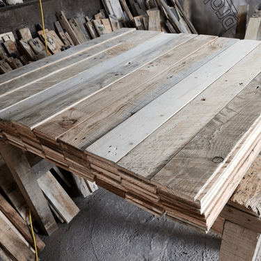 Stacked premium reclaimed wood planks for rustic wall cladding and DIY projects