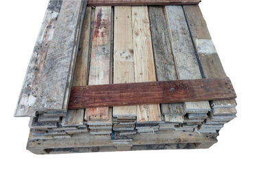 Stack of weathered reclaimed wood planks in various natural and rustic tones